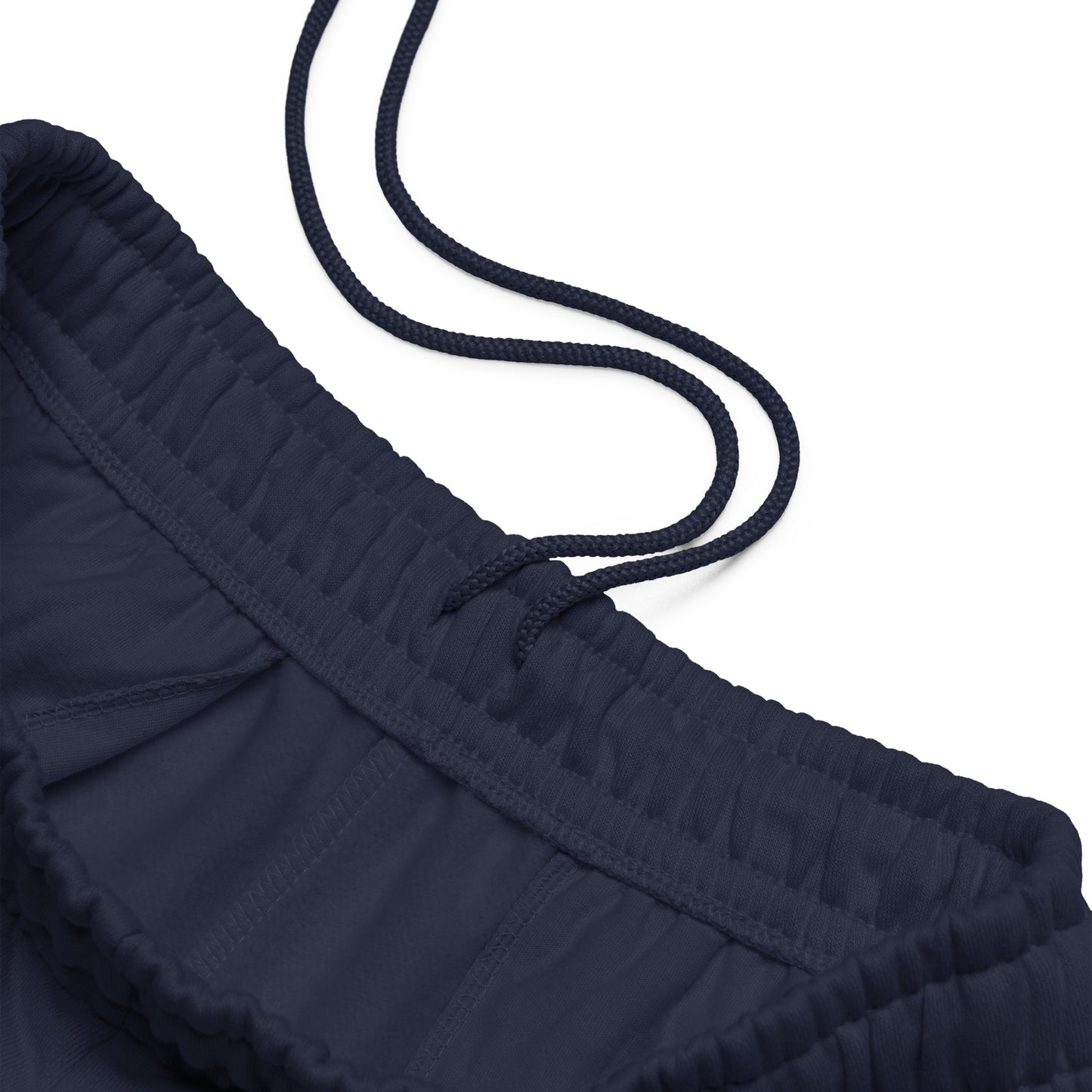 90s style boxy heavyweight sweatpants in navy with elastic waistband with drawstring - An Athlete Trains. Front view 