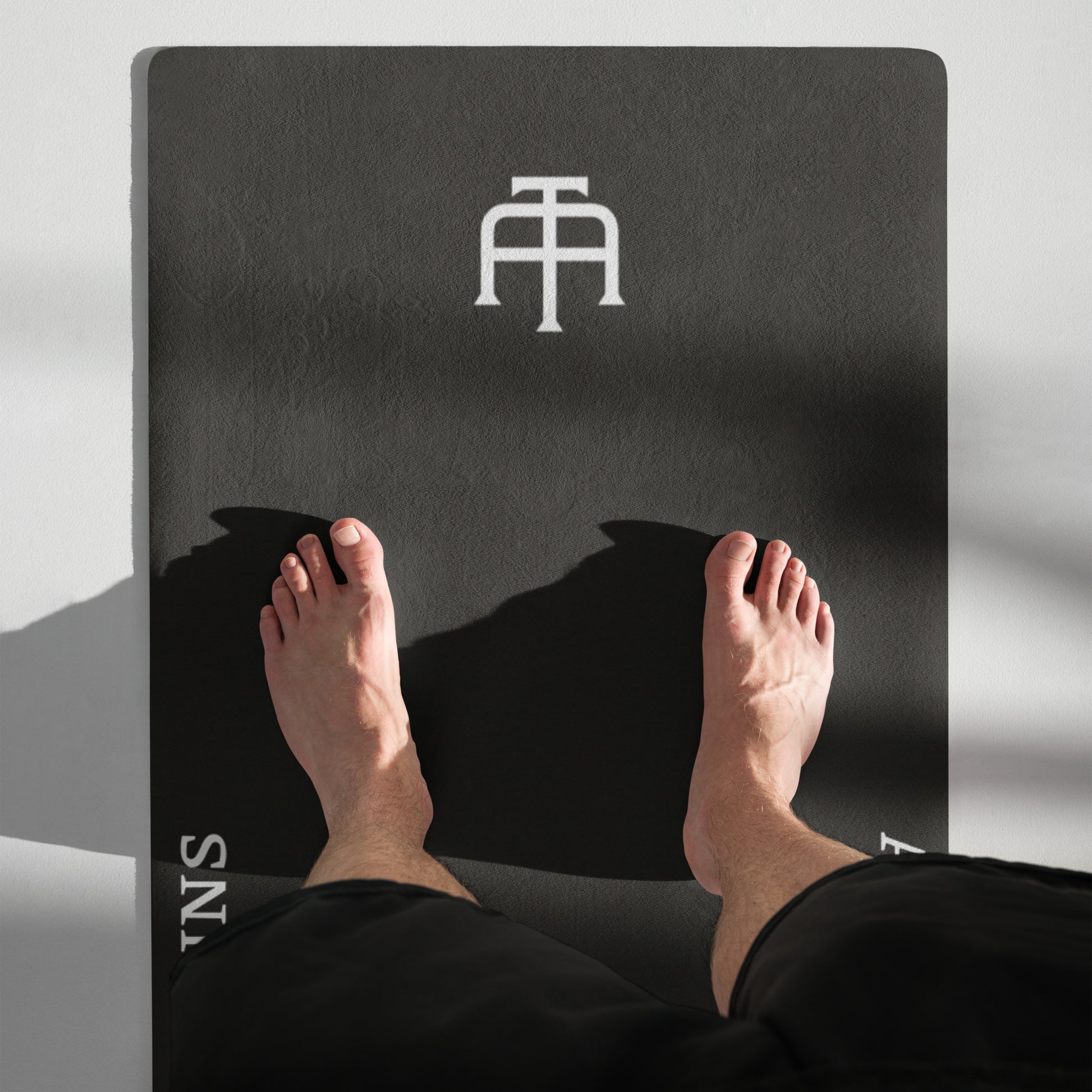 Black rubber yoga mat with a microsuede top by An Athlete Trains