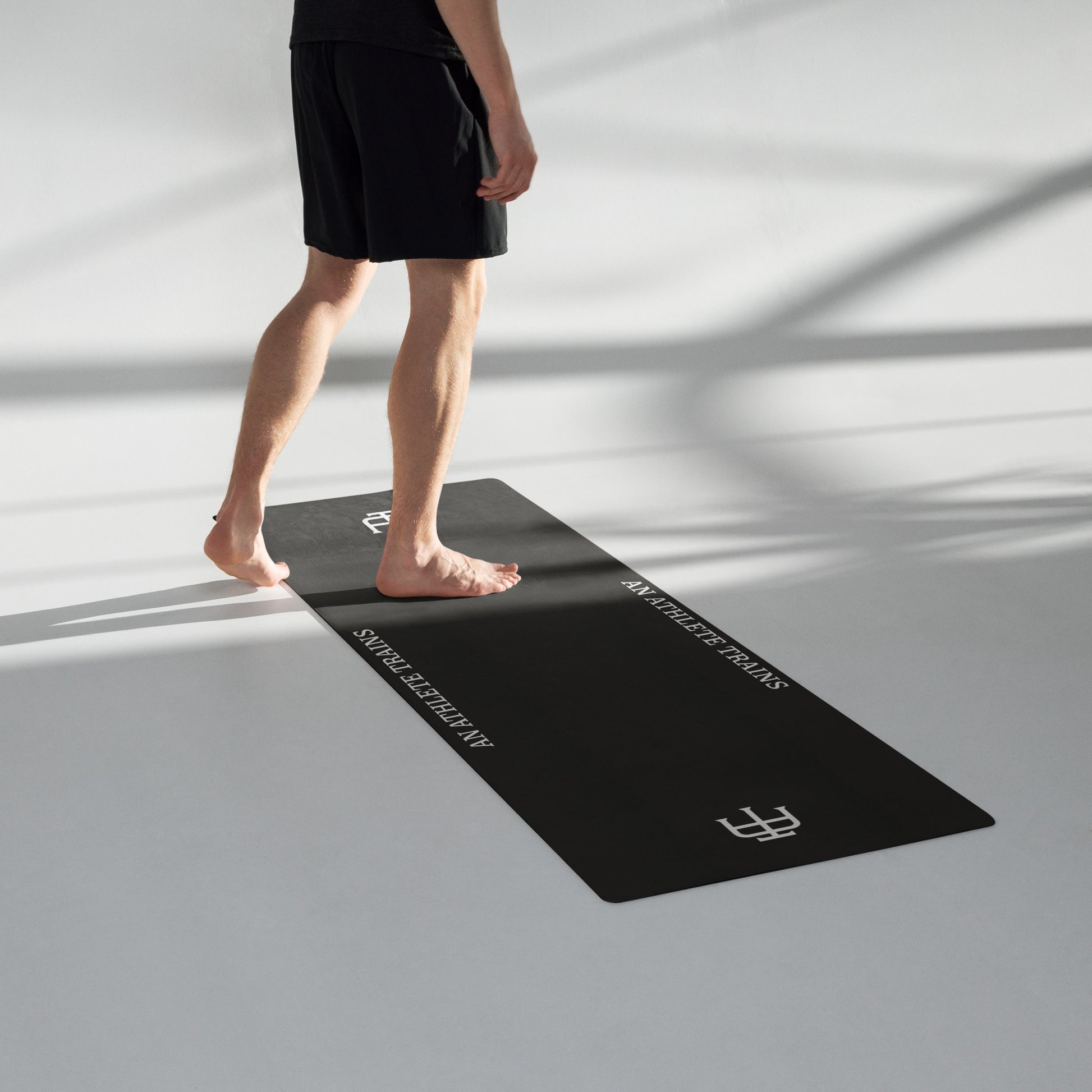 Black rubber yoga mat with a microsuede top by An Athlete Trains