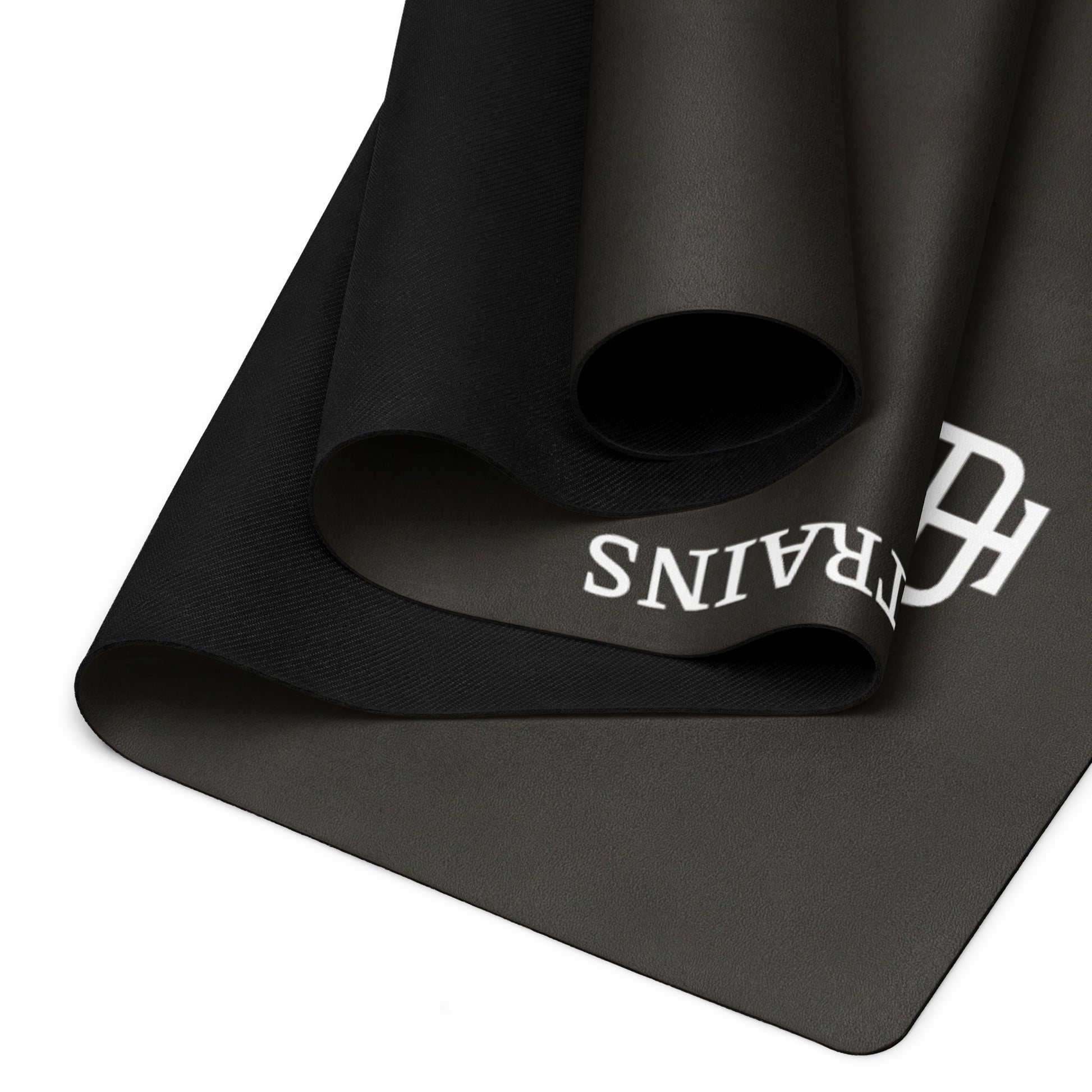 Black rubber yoga mat with a microsuede top by An Athlete Trains