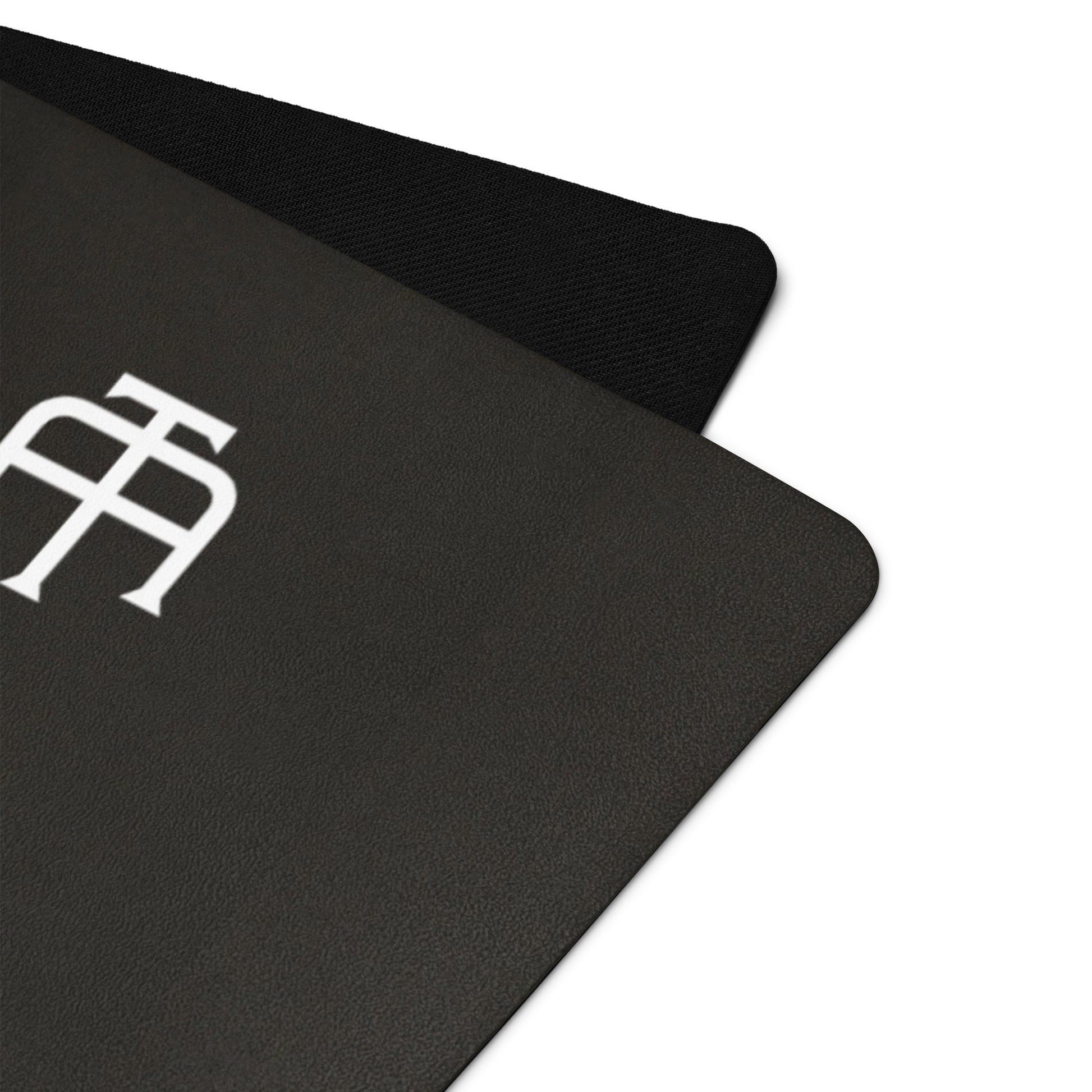 Black rubber yoga mat with a microsuede top by An Athlete Trains